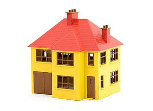 yellow and red plastic house toy